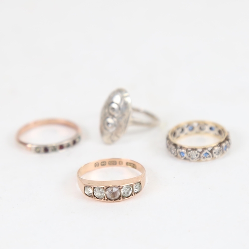 984 - A 9ct gold stone set ring, an eternity ring, and 2 others (4)