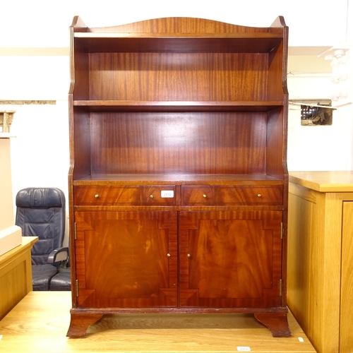 2572 - A reproduction mahogany open bookcase, with drawer and cupboards under, W70cm, H105cm, D26cm