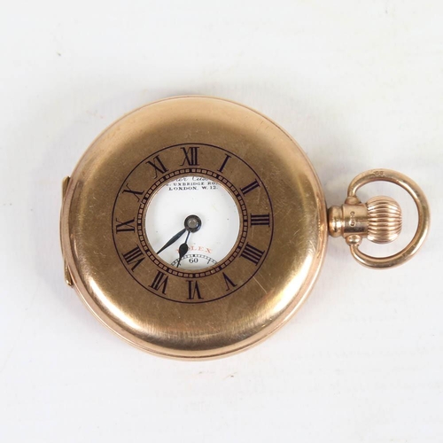 66 - ROLEX - an early 20th century 9ct gold half hunter pocket watch, retailed by Camerer Cuss & Co of Ux... 