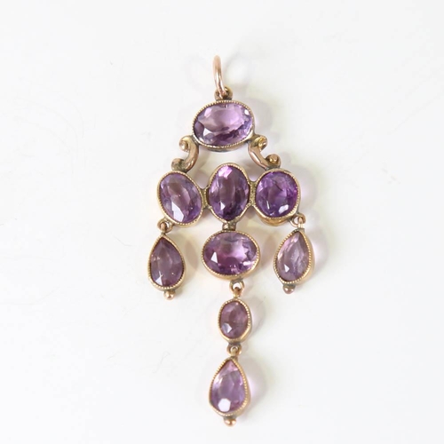 108 - A Victorian amethyst pendant, unmarked yellow metal settings with oval and pear cut amethysts, penda... 