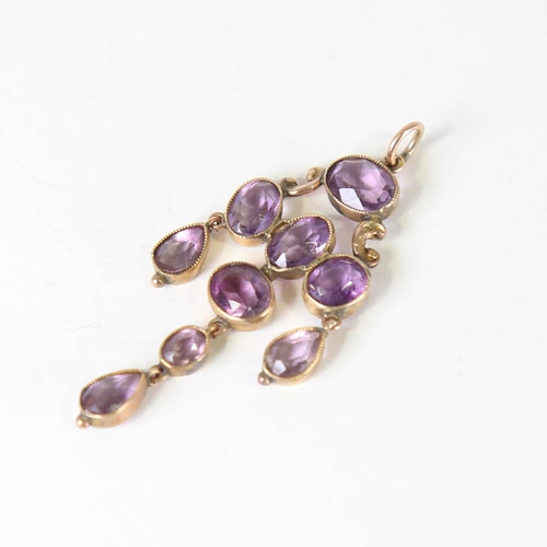 108 - A Victorian amethyst pendant, unmarked yellow metal settings with oval and pear cut amethysts, penda... 