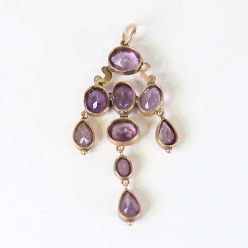 108 - A Victorian amethyst pendant, unmarked yellow metal settings with oval and pear cut amethysts, penda... 