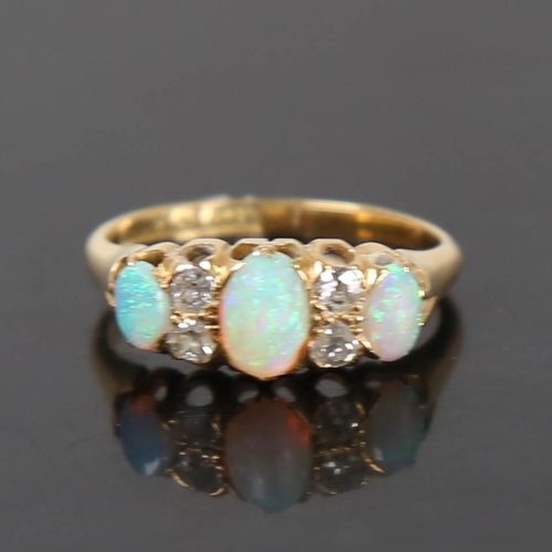 116 - An early 20th century 18ct gold 7-stone opal and diamond half hoop ring, set with oval cabochon opal... 