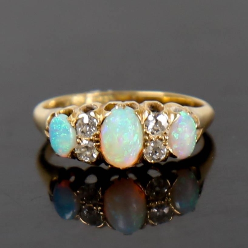 116 - An early 20th century 18ct gold 7-stone opal and diamond half hoop ring, set with oval cabochon opal... 