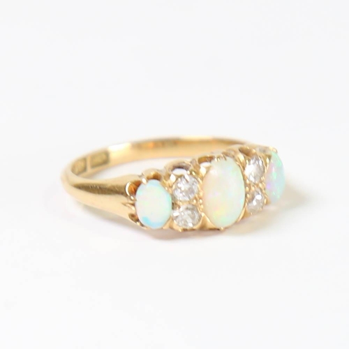 116 - An early 20th century 18ct gold 7-stone opal and diamond half hoop ring, set with oval cabochon opal... 