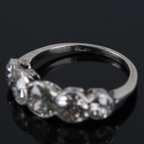 119 - A mid-20th century platinum graduated 5-stone diamond ring, bezel set with old European cut diamonds... 