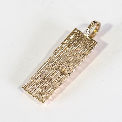 134 - A late 20th century 9ct gold Gold ingot pendant, textured settings, hallmarks London 1978, pendant h... 