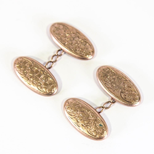 138 - A pair of early 20th century 9ct rose gold cufflinks, oval floral engraved panels, hallmarks Birming... 