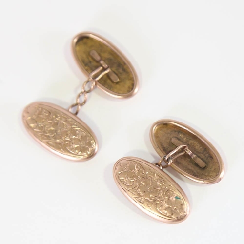 138 - A pair of early 20th century 9ct rose gold cufflinks, oval floral engraved panels, hallmarks Birming... 