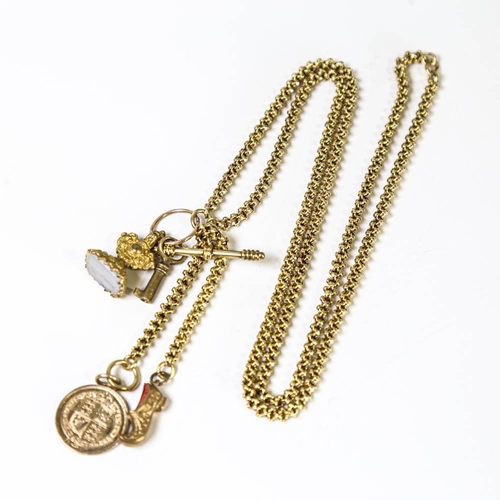 148 - A Victorian 15ct gold fancy link long guard chain, with various gilt metal charms including 'Hannah'... 