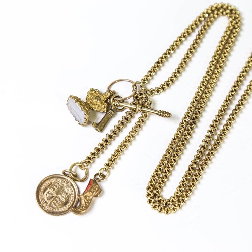 148 - A Victorian 15ct gold fancy link long guard chain, with various gilt metal charms including 'Hannah'... 