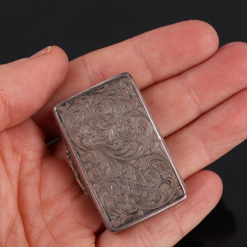 161 - A Victorian silver niello vinaigrette, rectangular form with allover engraved foliate decoration and... 