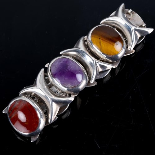 172 - A Vintage Mexican sterling silver gem-set bracelet, gemstones include amethyst, tiger's eye, jasper,... 