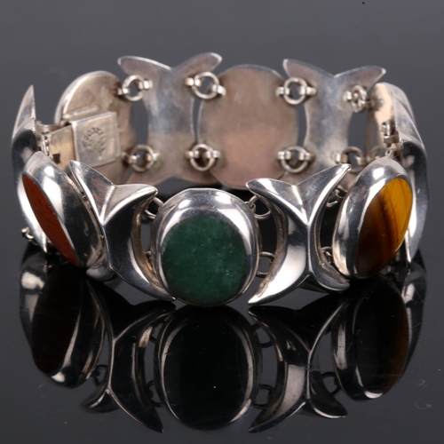 172 - A Vintage Mexican sterling silver gem-set bracelet, gemstones include amethyst, tiger's eye, jasper,... 