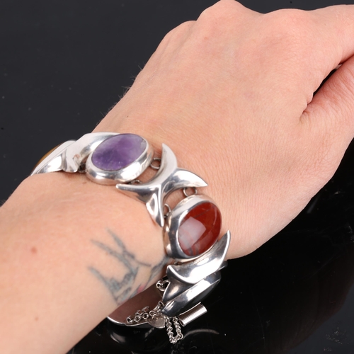 172 - A Vintage Mexican sterling silver gem-set bracelet, gemstones include amethyst, tiger's eye, jasper,... 