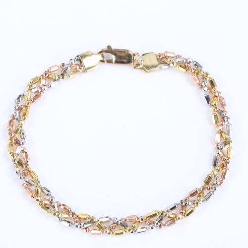 173 - A modern 9ct tri-colour gold twisted link bracelet, length 18.5cm, 6.8g