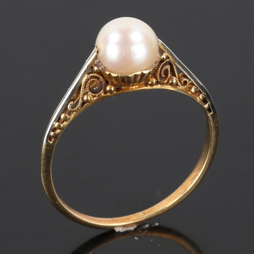 174 - A Japanese 14ct gold whole pearl ring, open scrollwork bridge and closed back settings, pearl diamet... 