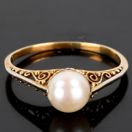 174 - A Japanese 14ct gold whole pearl ring, open scrollwork bridge and closed back settings, pearl diamet... 