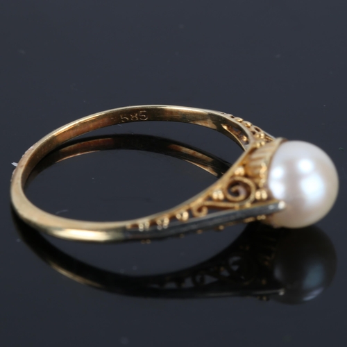 174 - A Japanese 14ct gold whole pearl ring, open scrollwork bridge and closed back settings, pearl diamet... 