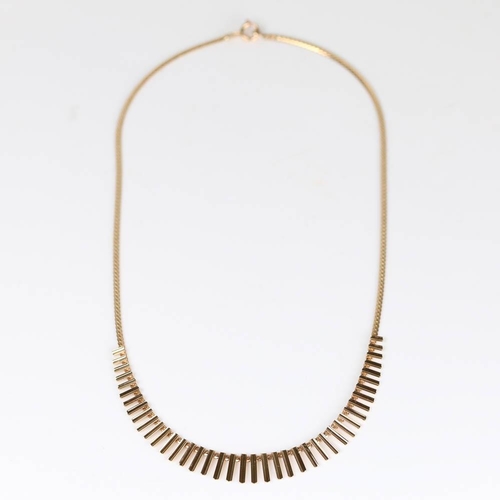 182 - A late 20th century 9ct gold fringe necklace, graduated half tube fringe with herringbone link chain... 