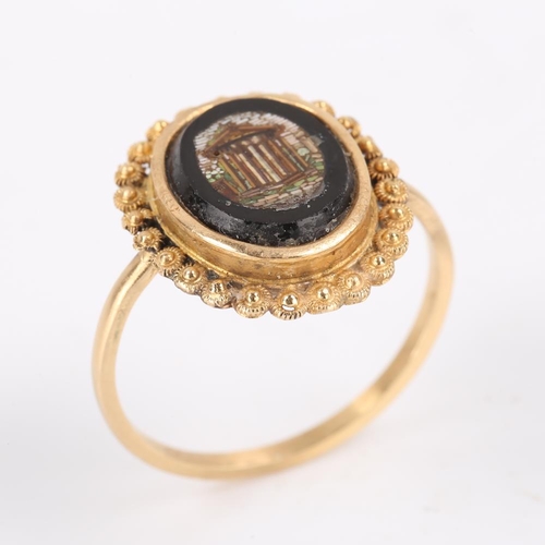 197 - An Antique Grand Tour micro mosaic panel dress ring, depicting ruins within a cannetille surround, s... 