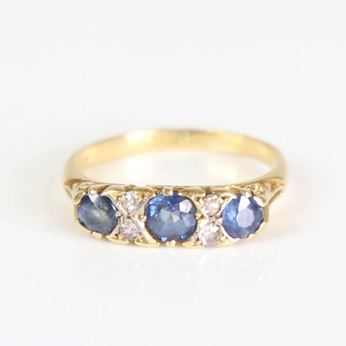 203 - An early 20th century 18ct gold 7-stone sapphire and diamond half hoop ring, set with round cut sapp... 