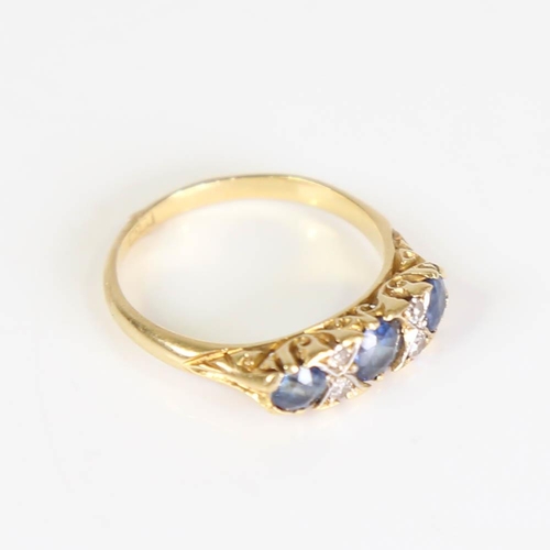 203 - An early 20th century 18ct gold 7-stone sapphire and diamond half hoop ring, set with round cut sapp... 