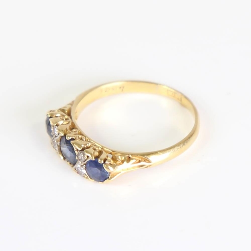 203 - An early 20th century 18ct gold 7-stone sapphire and diamond half hoop ring, set with round cut sapp... 