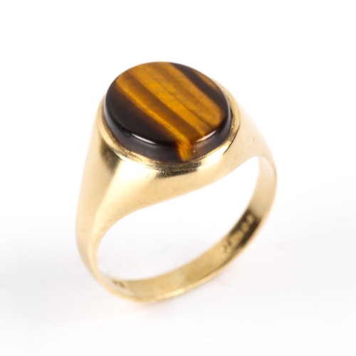 204 - A late 20th century 9ct gold tiger's eye signet ring, hallmarks London 1979, setting height 15.7mm, ... 