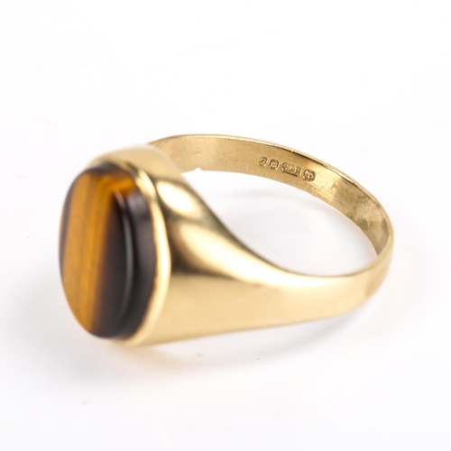 204 - A late 20th century 9ct gold tiger's eye signet ring, hallmarks London 1979, setting height 15.7mm, ... 