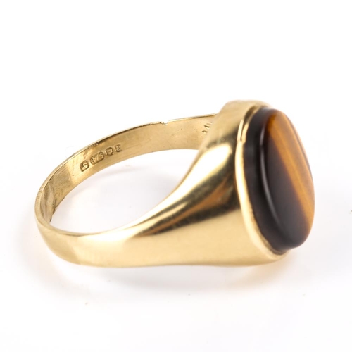 204 - A late 20th century 9ct gold tiger's eye signet ring, hallmarks London 1979, setting height 15.7mm, ... 