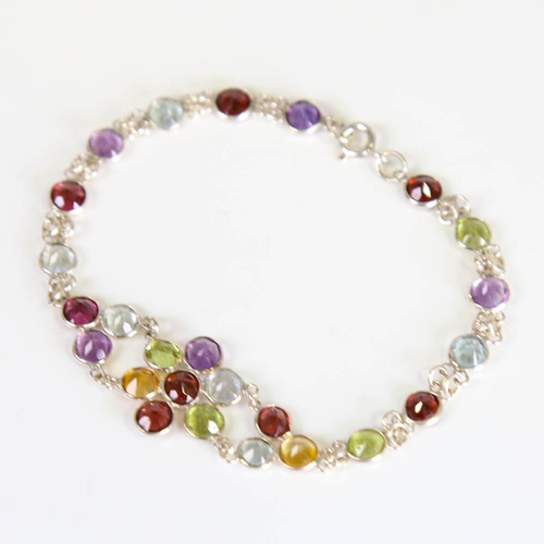 205 - A modern handmade silver gem-set floral bracelet, round cut gemstones include peridot, citrine, amet... 