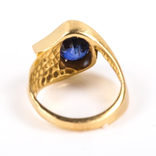 206 - A modern Continental 14ct gold synthetic sapphire and diamond crossover ring, heavy wraparound setti... 