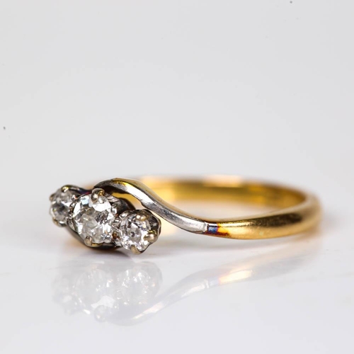 207 - An early 20th century 18ct gold 3-stone diamond crossover ring, set with old European cut diamonds, ... 