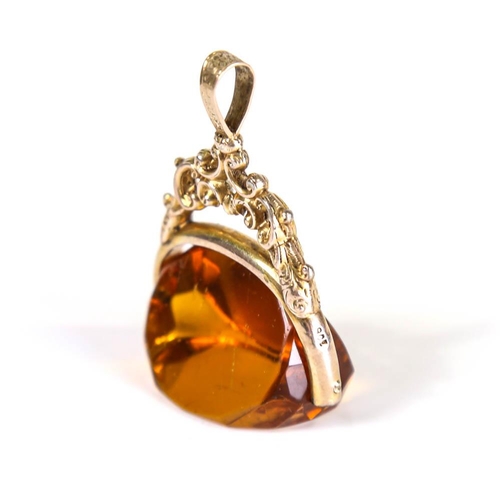 208 - A large Victorian 9ct gold citrine swivel fob, openwork and engraved foliate decoration, citrine len... 