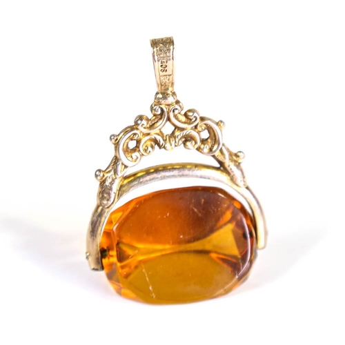 208 - A large Victorian 9ct gold citrine swivel fob, openwork and engraved foliate decoration, citrine len... 