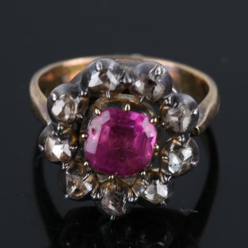 209 - A Georgian ruby and diamond cluster ring, unmarked gold closed back settings with square emerald cut... 