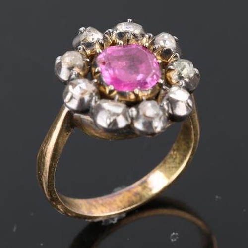 209 - A Georgian ruby and diamond cluster ring, unmarked gold closed back settings with square emerald cut... 