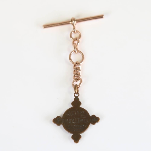 210 - A short Antique 9ct rose gold Albert chain, with T-bar and brass St. John's Air Ambulance Associatio... 