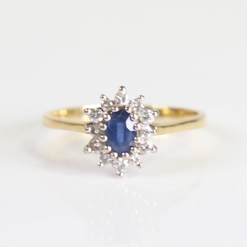 213 - A late 20th century 18ct gold sapphire and diamond cluster ring, set with oval mixed cut sapphire an... 