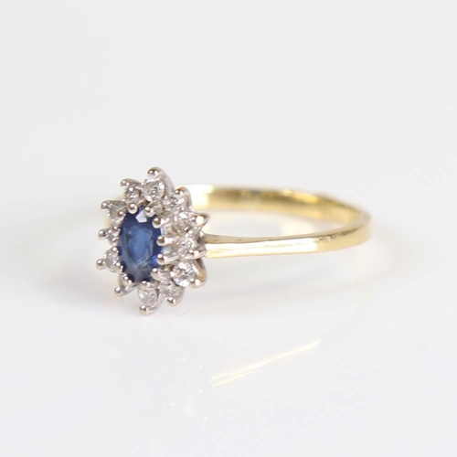 213 - A late 20th century 18ct gold sapphire and diamond cluster ring, set with oval mixed cut sapphire an... 