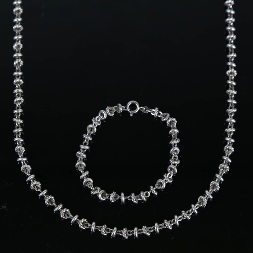 353 - A late 20th century silver fancy link matching necklace and bracelet set, import hallmarks London 19... 