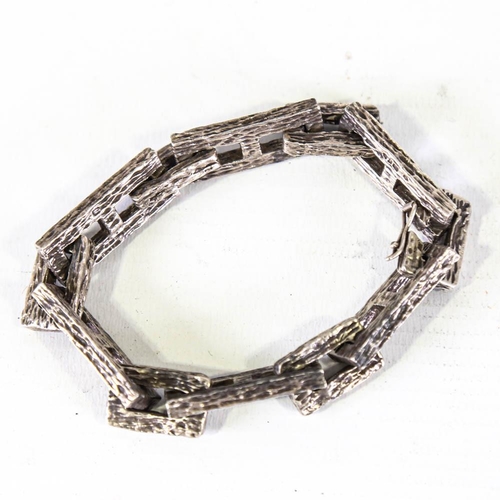 357 - A heavy Vintage silver abstract bracelet, naturalistic bark block link form, maker's mark AMG, hallm... 