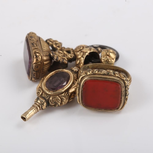 380 - 3 x 19th century gilt metal fobs, comprising amethyst pocket watch key and 2 stone set seal fobs, ke... 