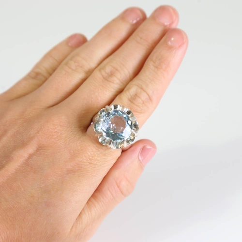 381 - A large modern handmade silver blue topaz crown ring, set with round cut topaz, setting height 21.1m... 