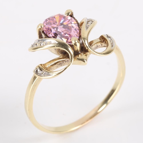 384 - A 14ct gold pink paste and diamond dress ring, openwork settings with pear cut paste and eight cut d... 