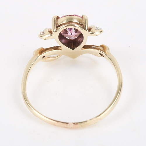 384 - A 14ct gold pink paste and diamond dress ring, openwork settings with pear cut paste and eight cut d... 