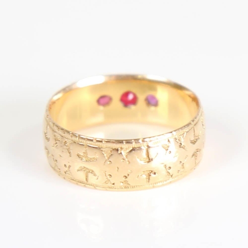 397 - A Victorian 18ct gold 3-stone ruby and garnet band ring, set with round cut gemstones and engraved d... 