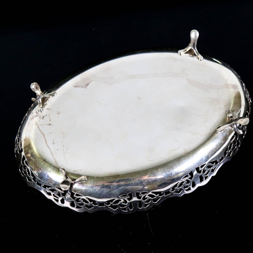 406 - A George VI silver dessert dish, oval form with pierced gallery raised on four feet, by Viner's Ltd,... 