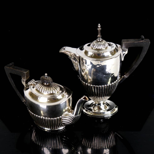 407 - An Edwardian silver 4-piece matched teaset, comprising coffee pot, teapot, two-handled sugar bowl an... 